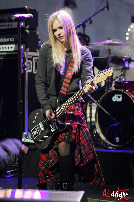 Avril Lavigne on stage with guitar