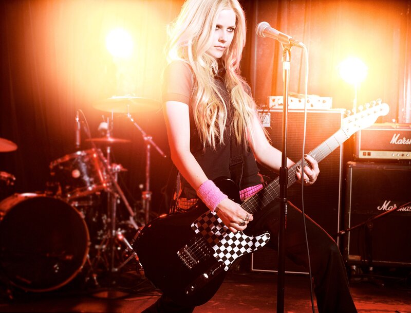 Avril Lavigne on stage with guitar