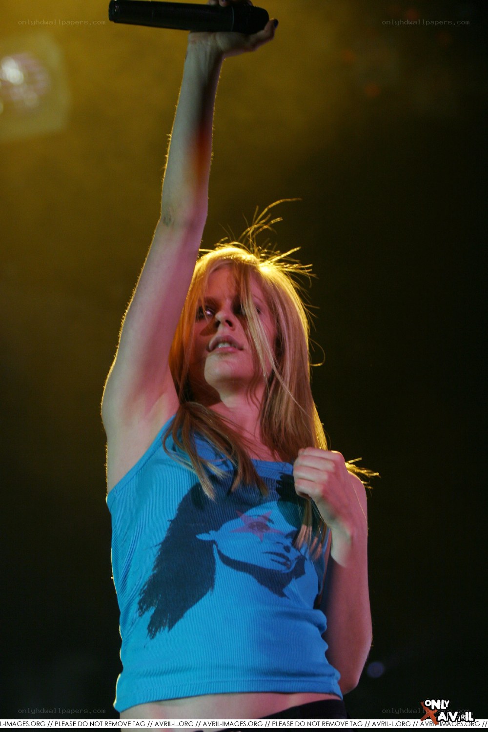Avril Lavigne performing on stage