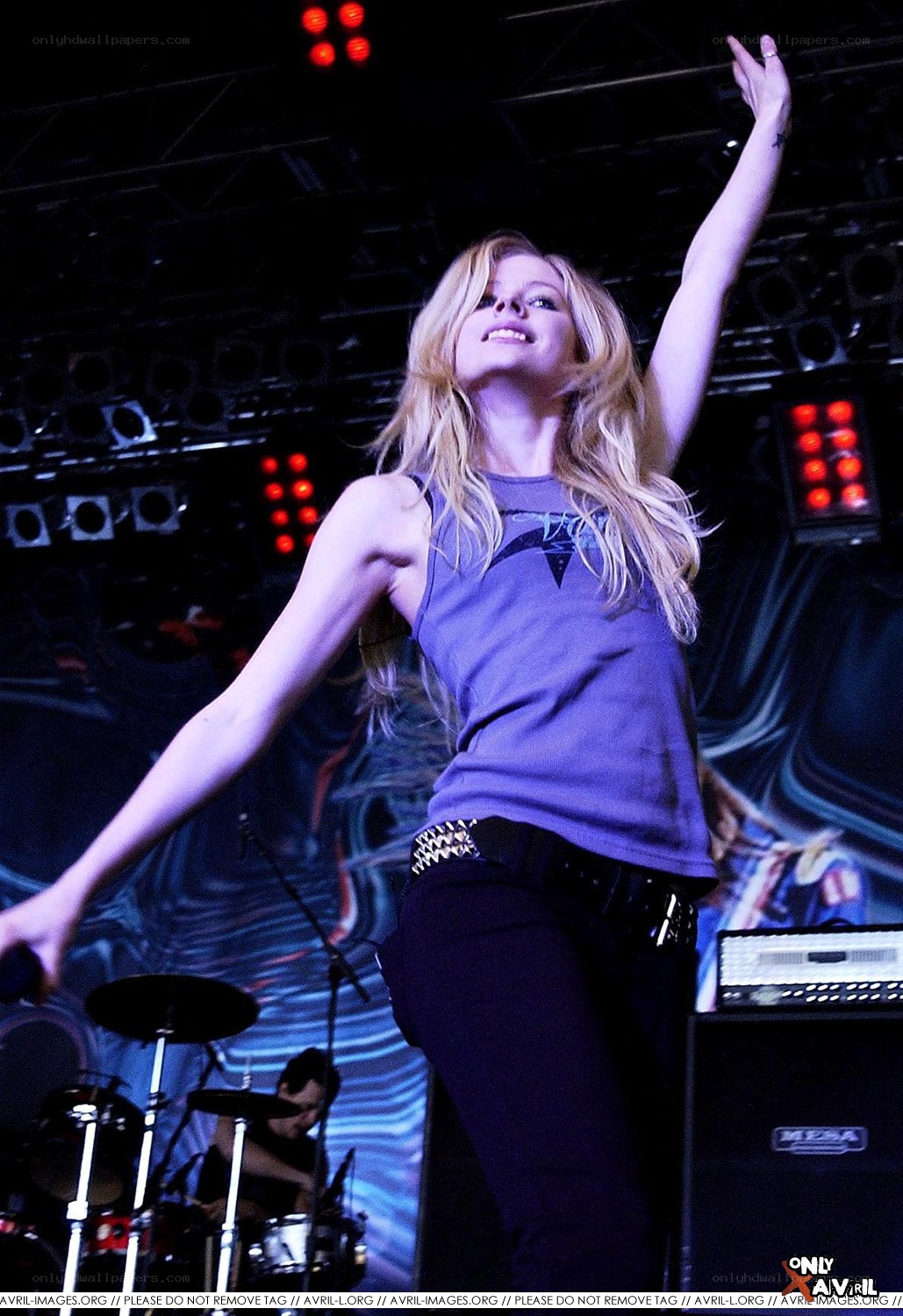 Avril Lavigne performing on stage