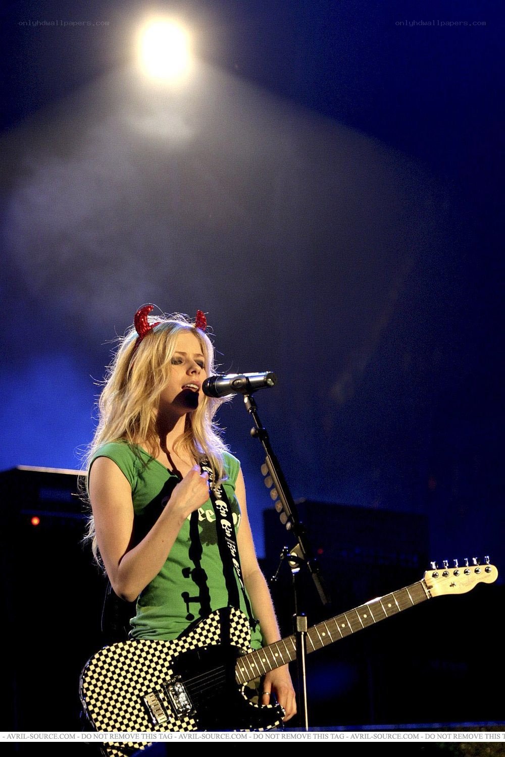 Avril Lavigne performing on stage