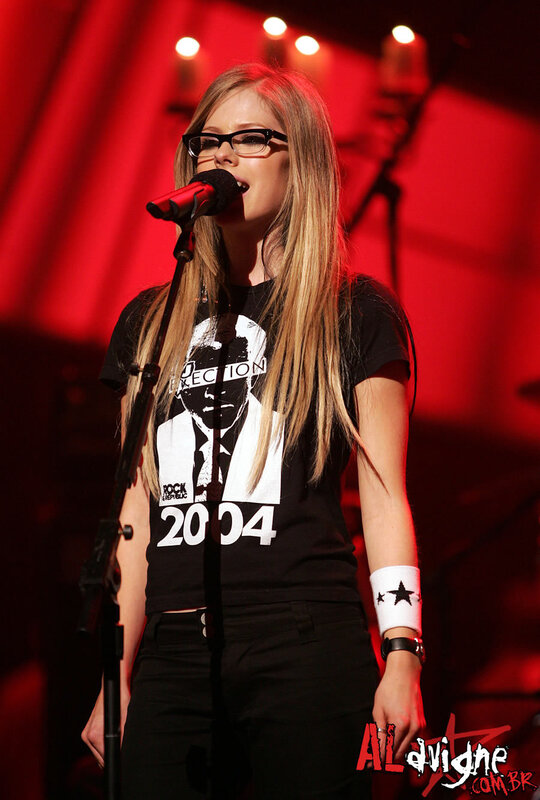Avril Lavigne performing on stage