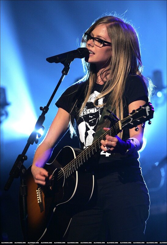 Avril Lavigne performing on stage