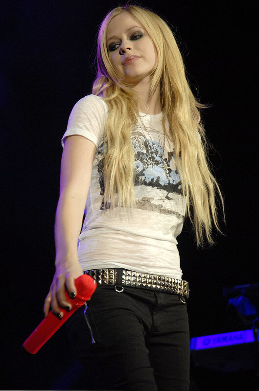 Avril Lavigne performing on stage