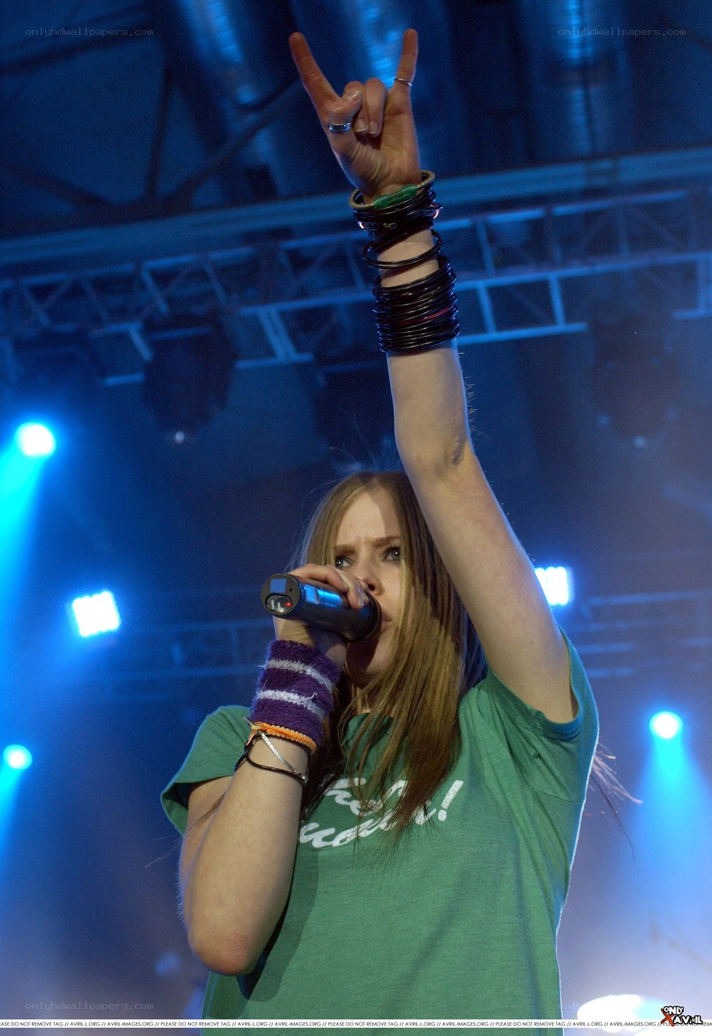 Avril Lavigne performing on stage