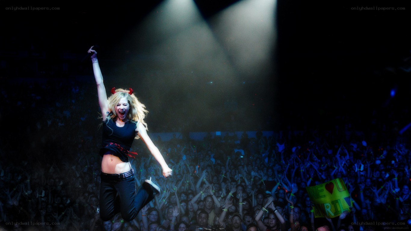 Avril Lavigne performing on stage