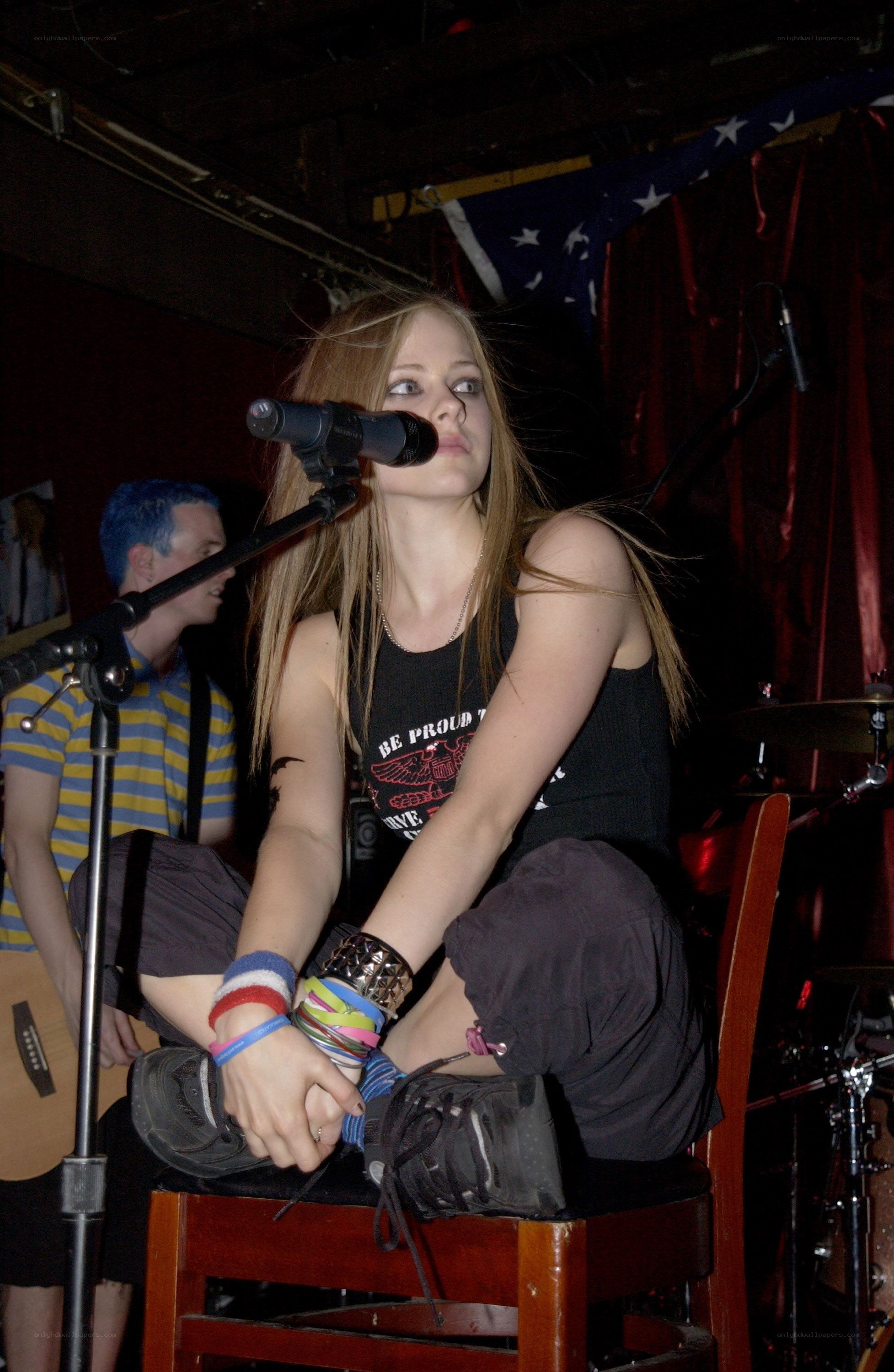 Avril Lavigne performing on stage