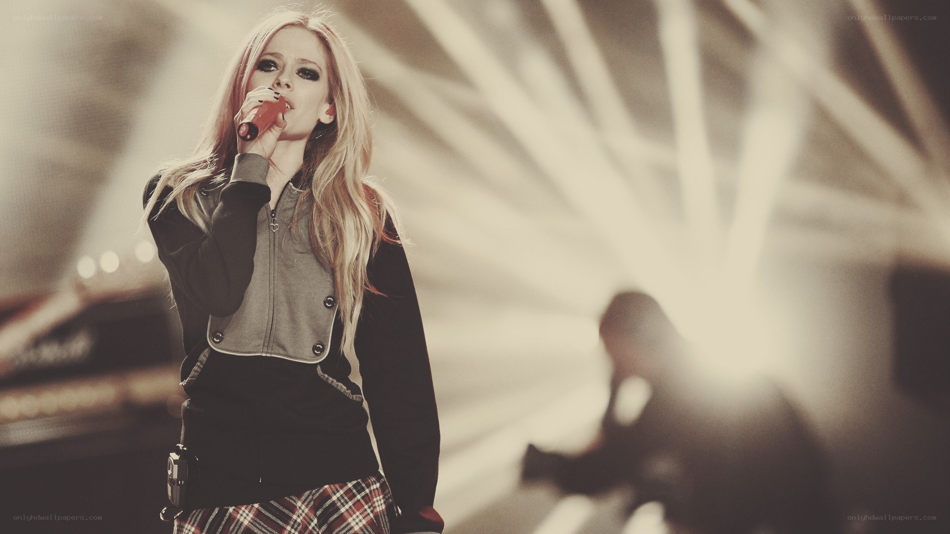 Avril Lavigne performing on stage