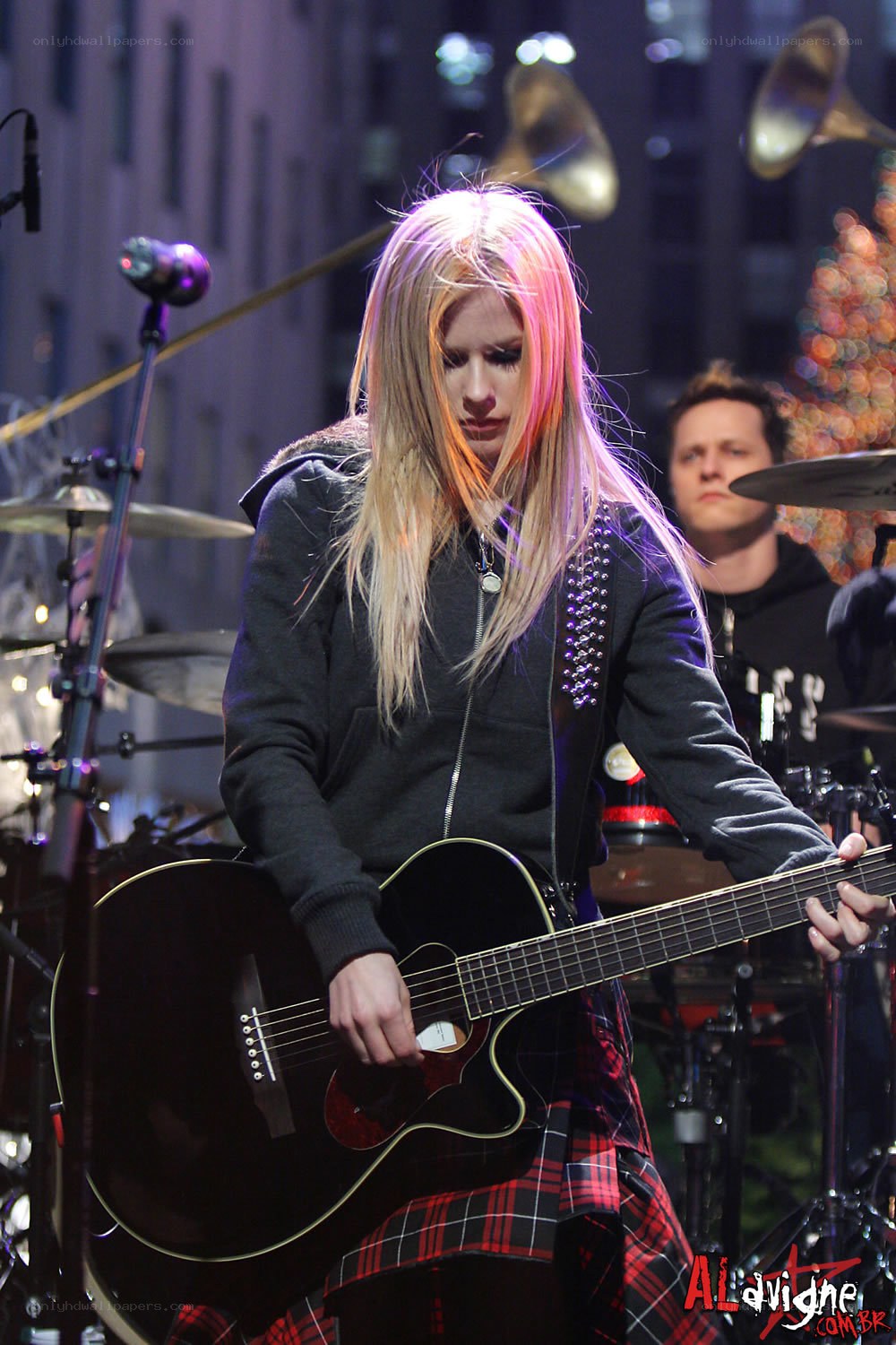 Avril Lavigne performing on stage
