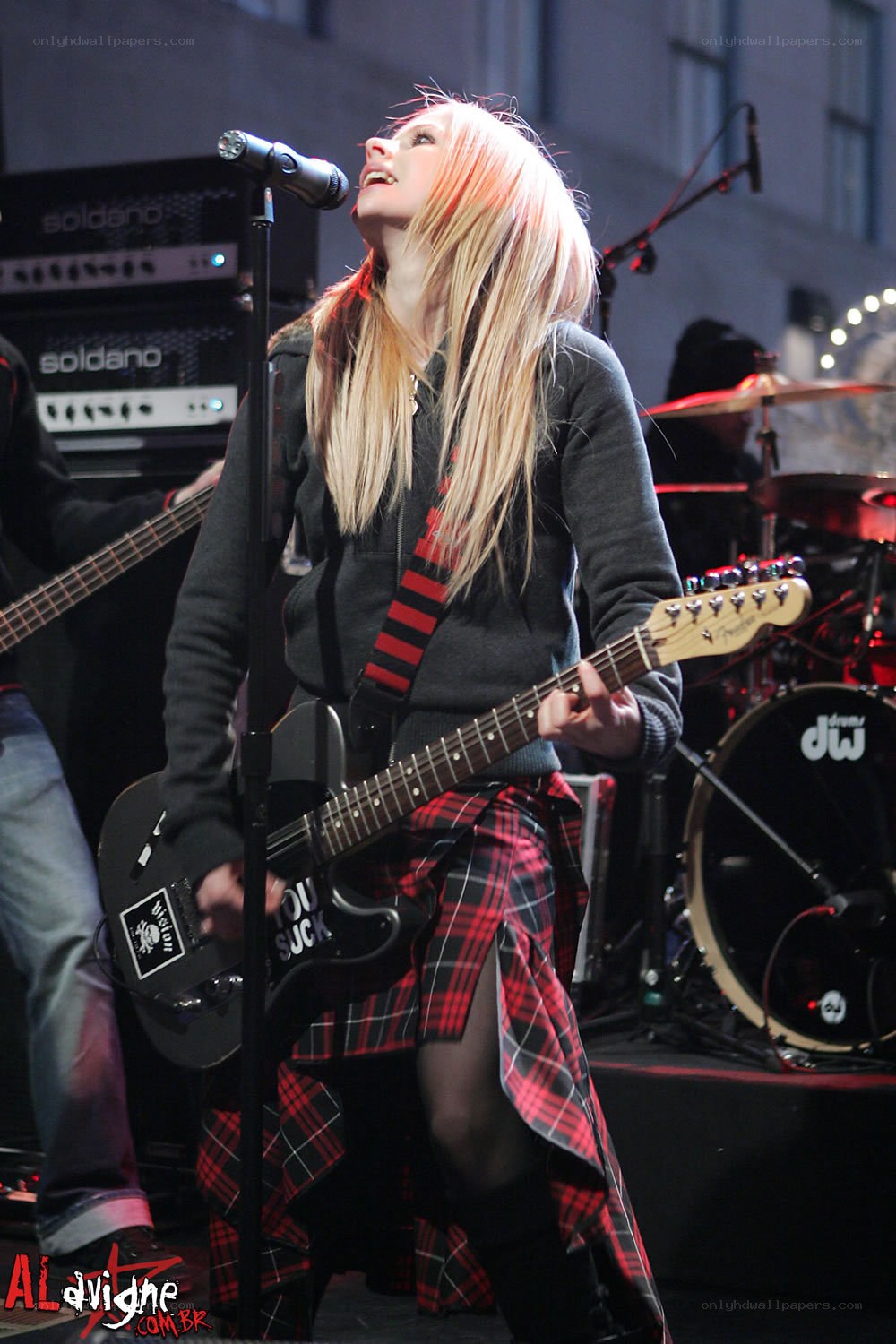 Avril Lavigne performing on stage