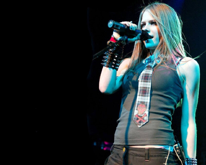 Avril Lavigne performing on stage