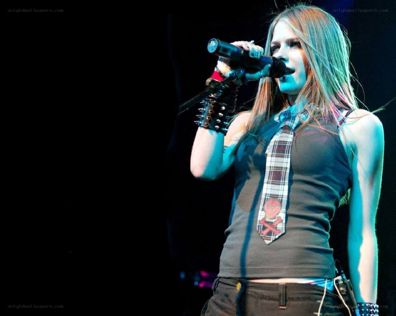 Avril Lavigne performing on stage