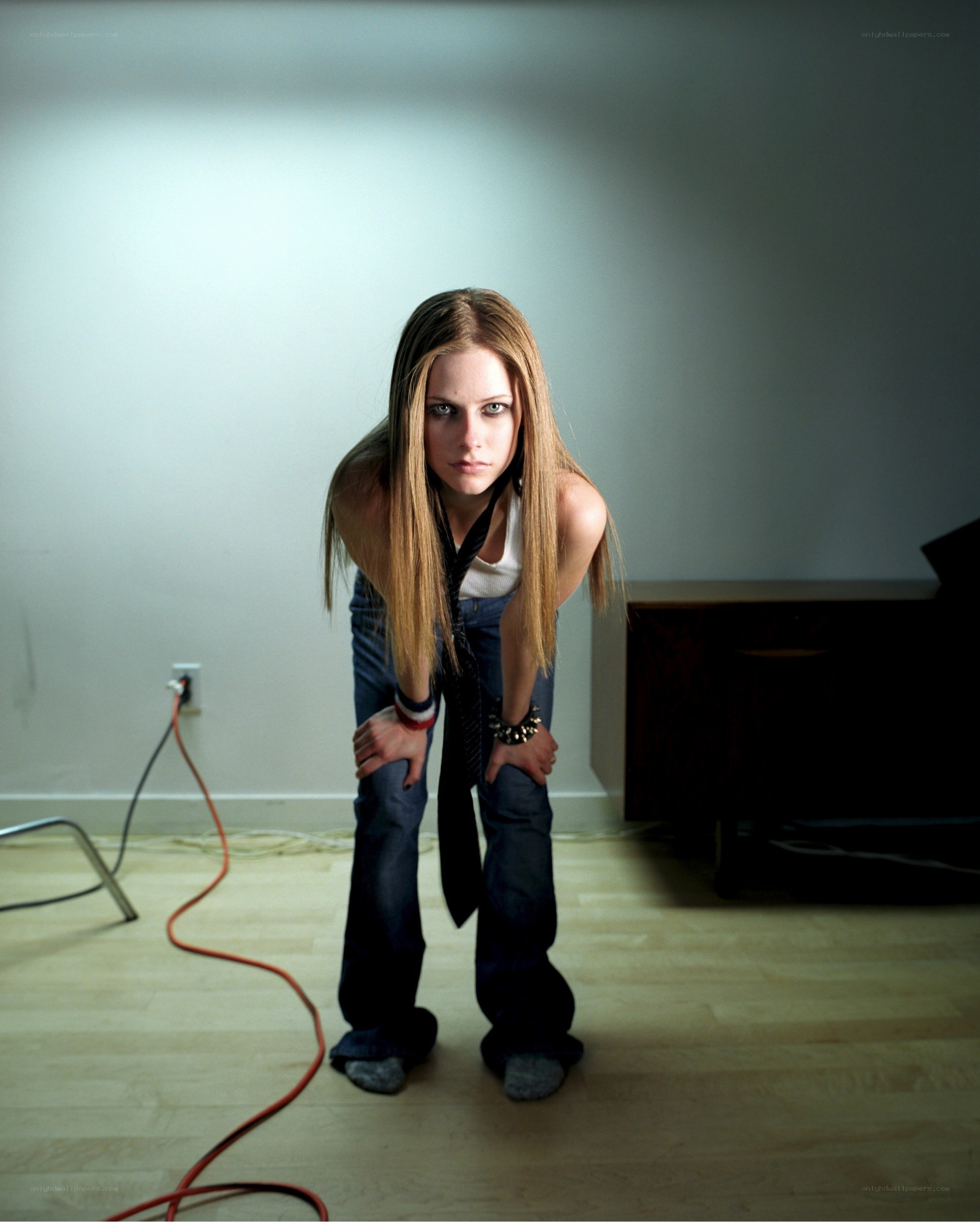 Avril Lavigne posing in a room