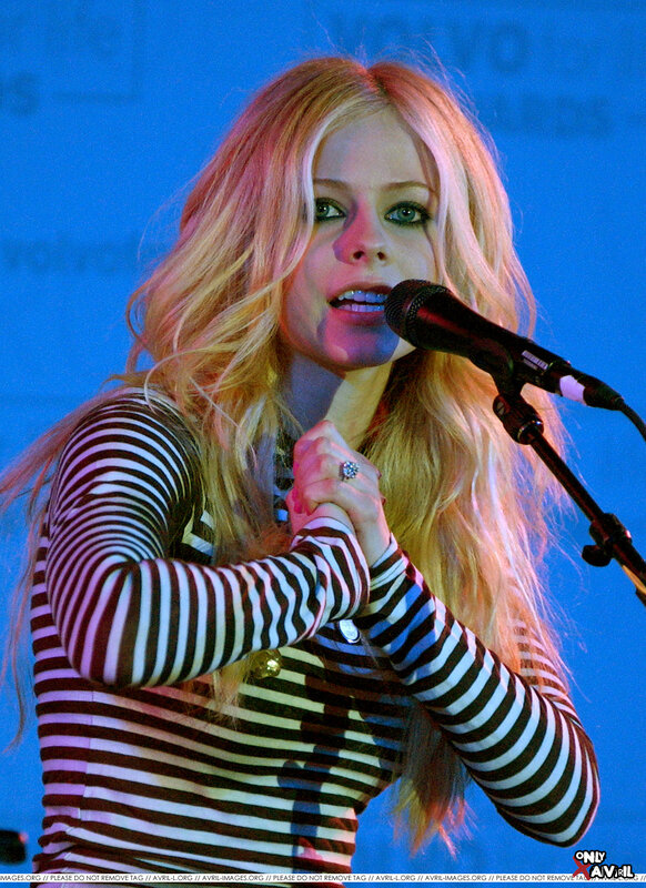 Avril Lavigne singing on stage