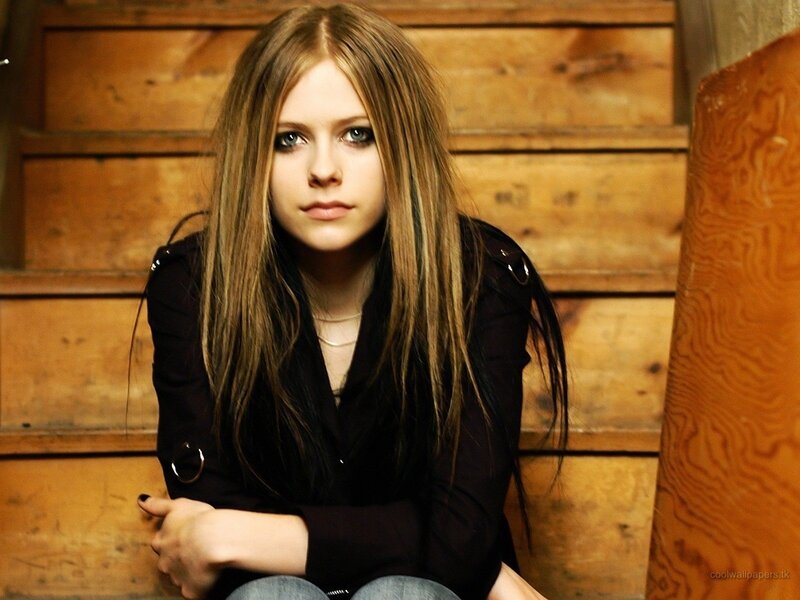 Avril Lavigne sitting on stairs