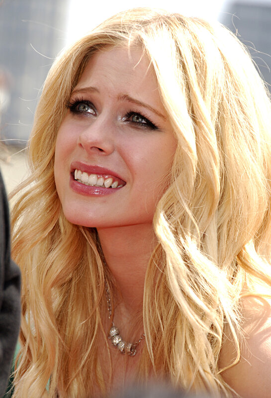 Avril Lavigne smiling at event