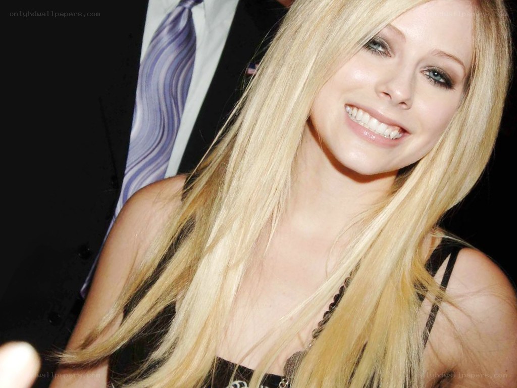 Avril Lavigne smiling at event