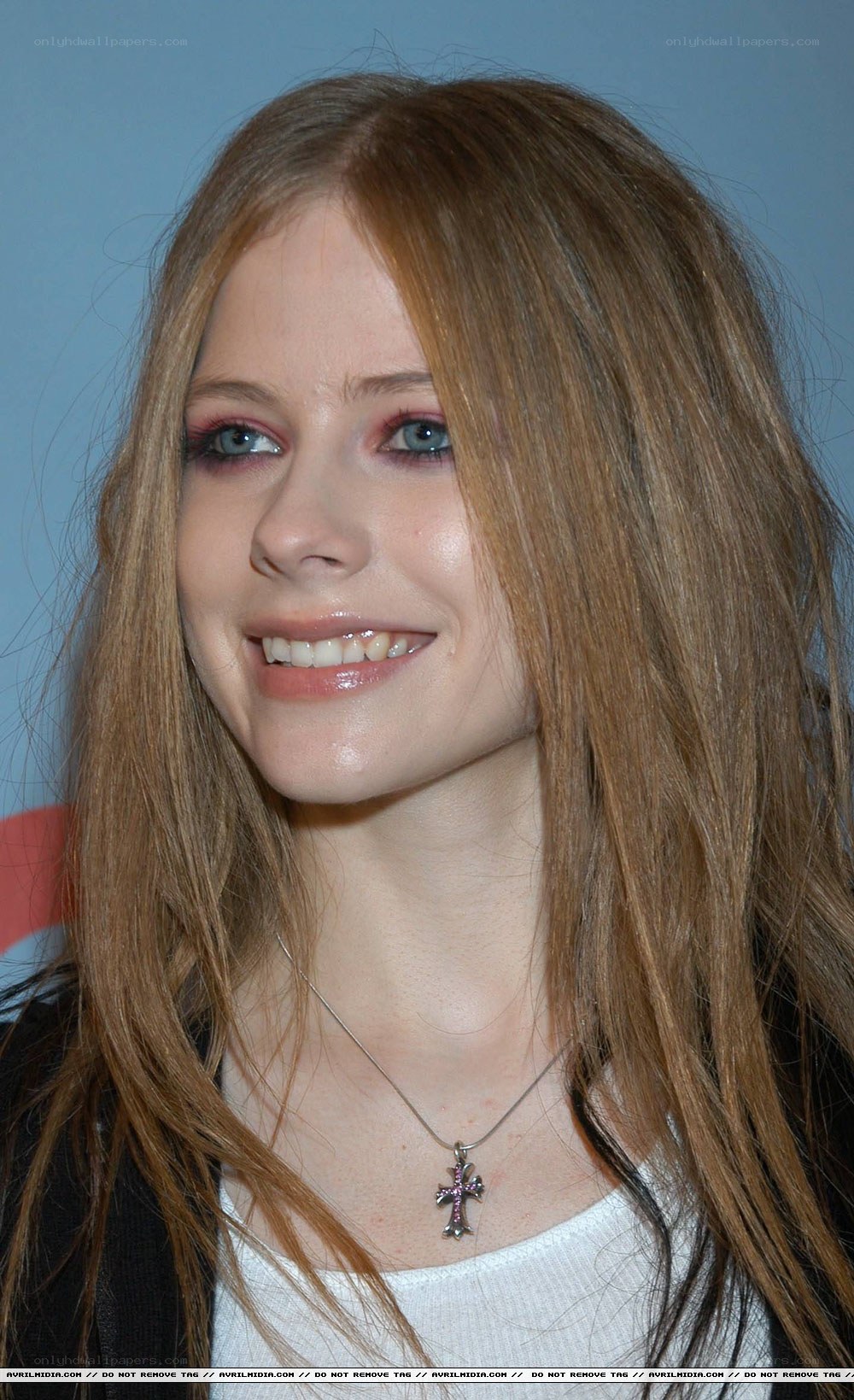 Avril Lavigne smiling at event