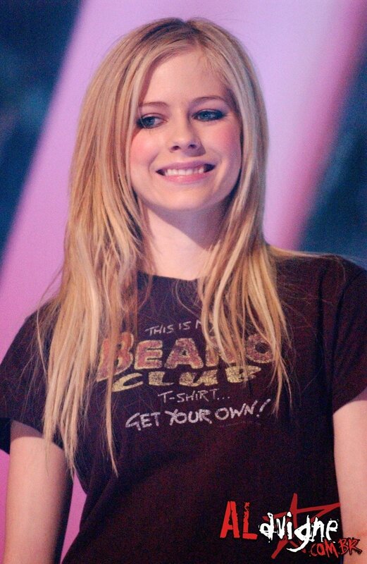 Avril Lavigne smiling on stage