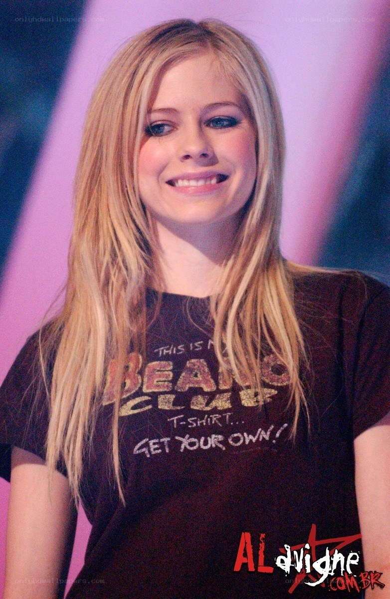Avril Lavigne smiling on stage