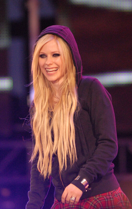 Avril Lavigne smiling on stage