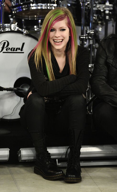 Avril Lavigne smiling on stage