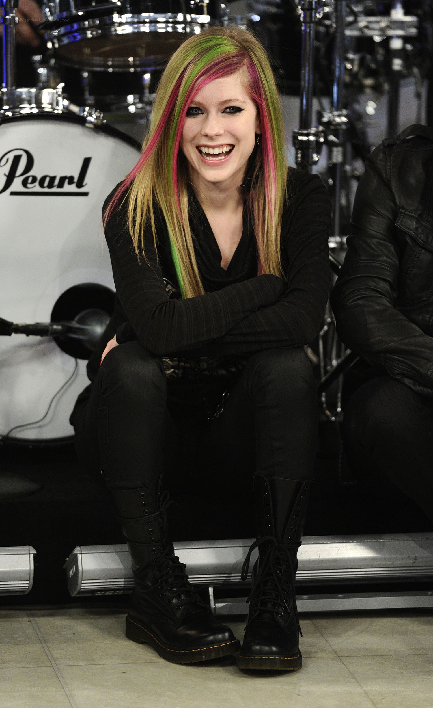 Avril Lavigne smiling on stage
