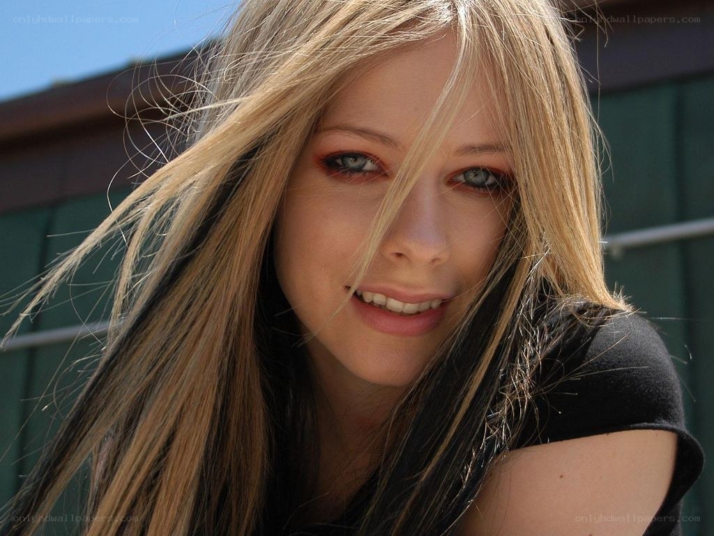Avril Lavigne smiling outdoors