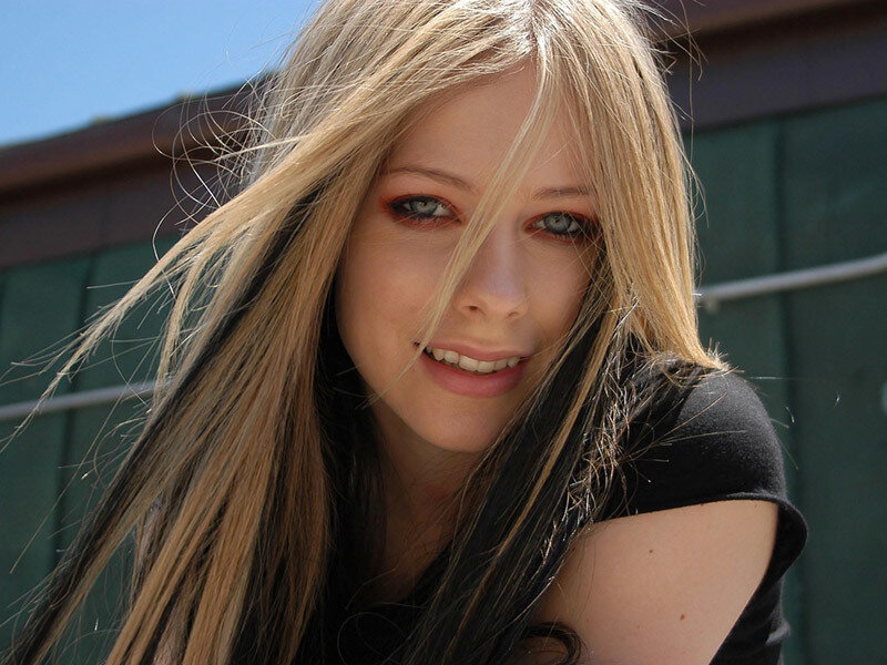 Avril Lavigne smiling outdoors