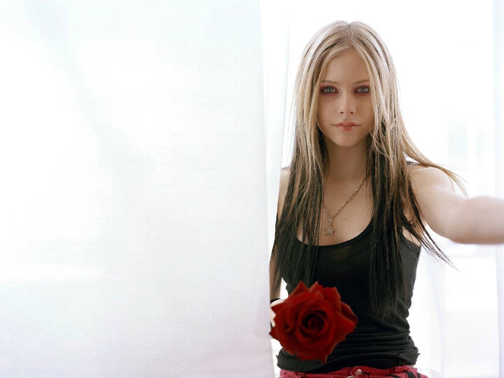 Avril Lavigne with a red rose