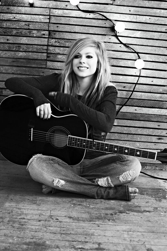 Avril Lavigne with acoustic guitar