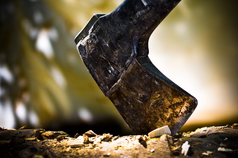Axe Embedded in Wood — Brown