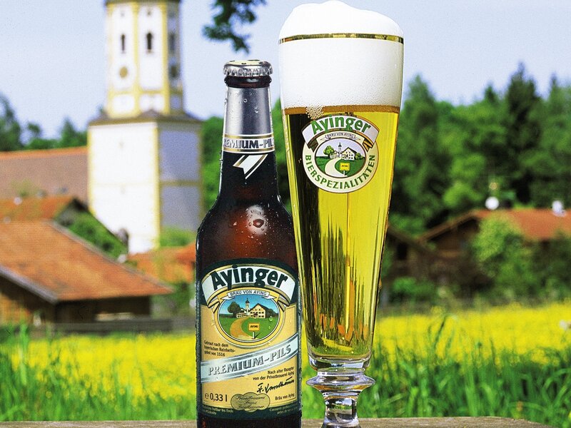 Ayinger beer in a field
