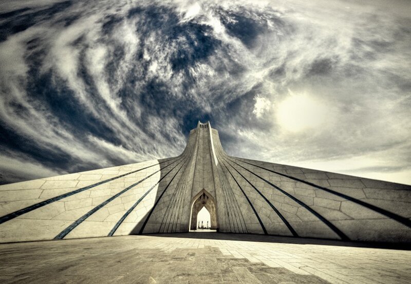 Azadi Tower under dramatic sky