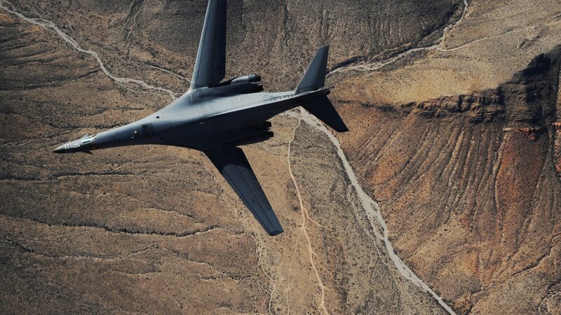 B-1 Lancer Bomber — Gray, Dramatic, Afternoon, Photograph, Aircraft, Desert, Canyon, Brown, Tan