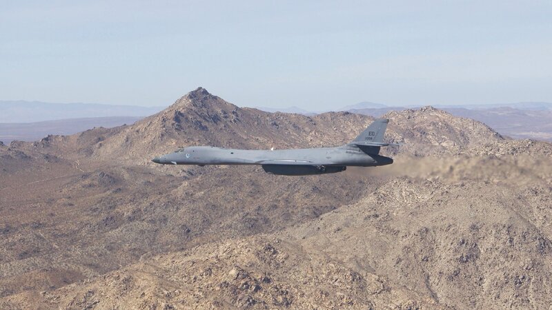 B-1 Lancer Bomber — Gray, Dramatic, Afternoon, Photograph, Mountain Range