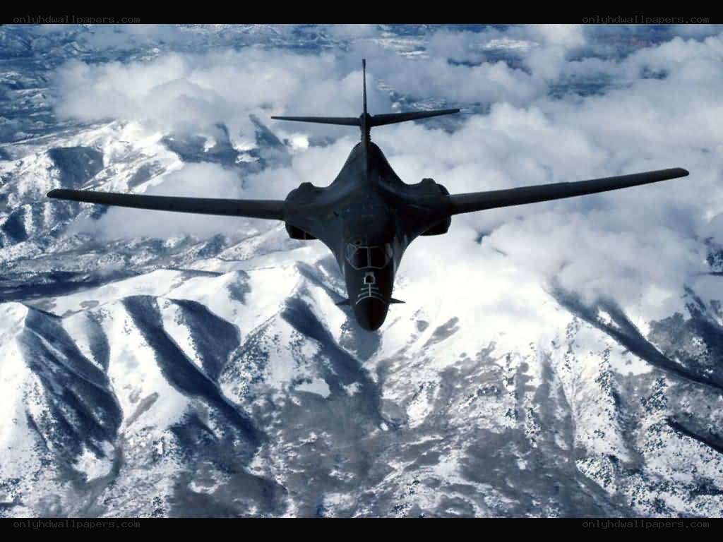 B-1 Lancer over snowy mountains