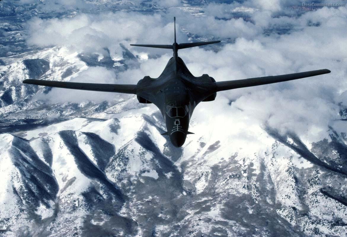 B-1 Lancer over snowy mountains