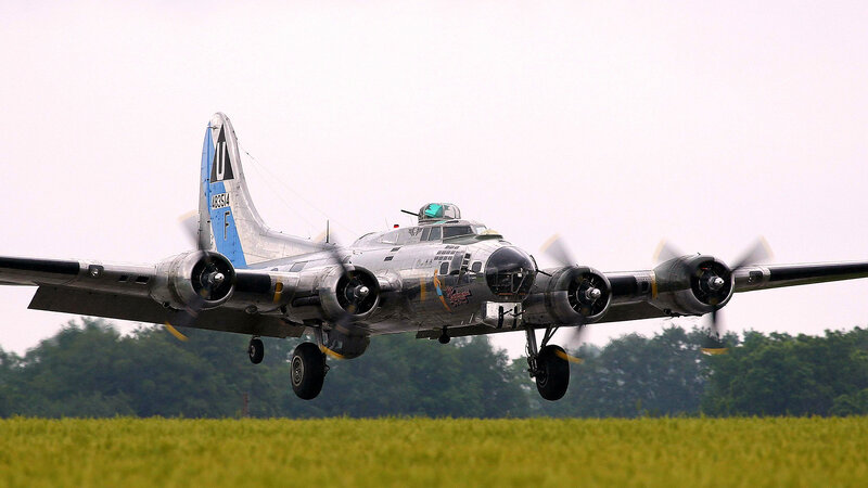 B-17 Bomber Aircraft — Green, Calm, Afternoon, Photograph, Wheels