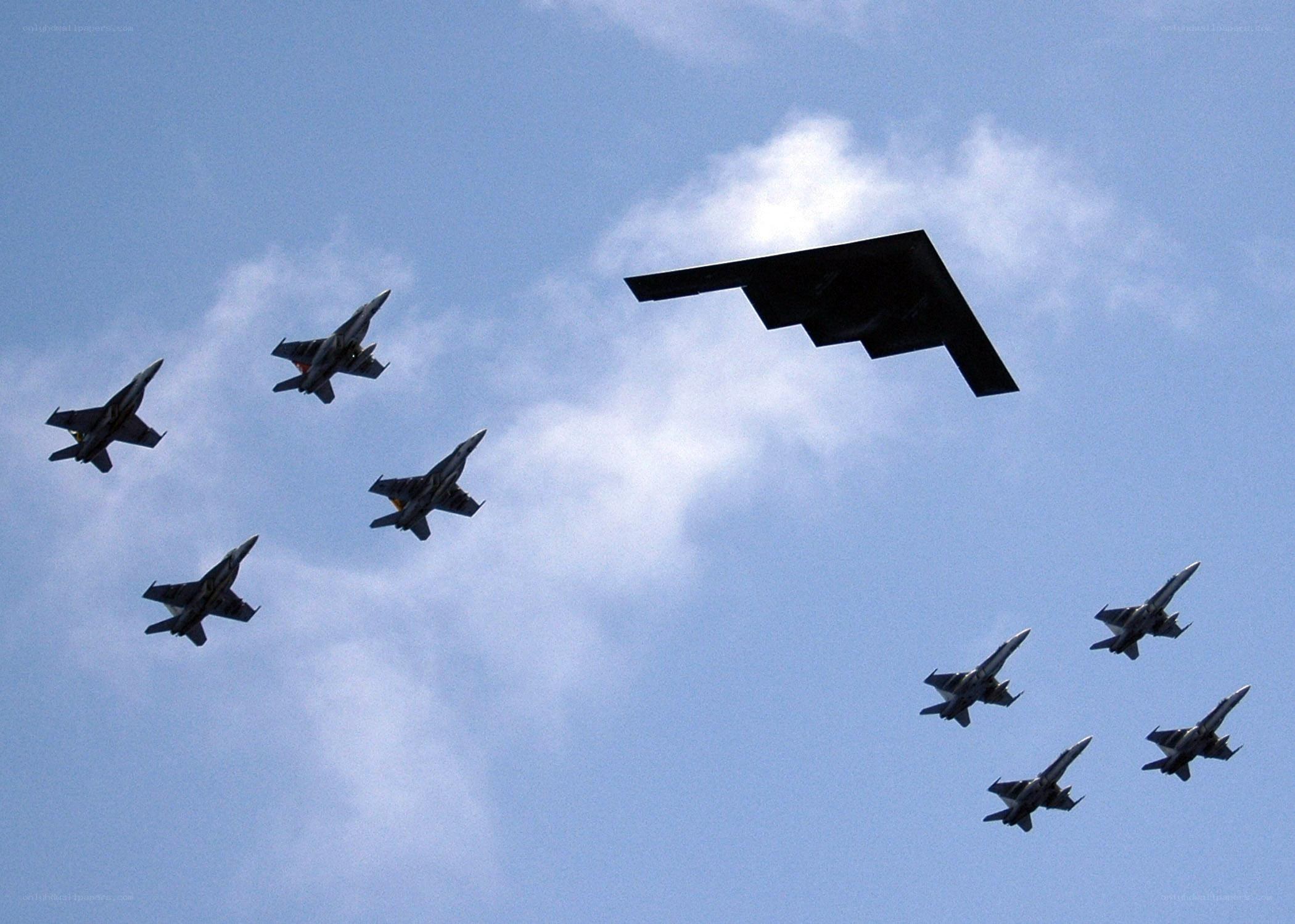 B-2 bomber with fighter escorts