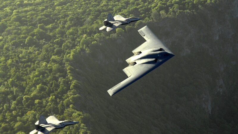 B-2 Spirit and F-22 Raptors in flight