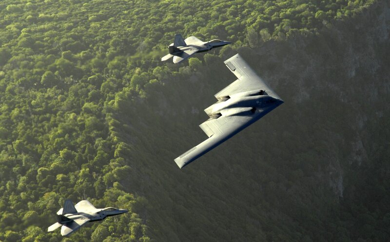 B-2 Spirit and F-22 Raptors in flight