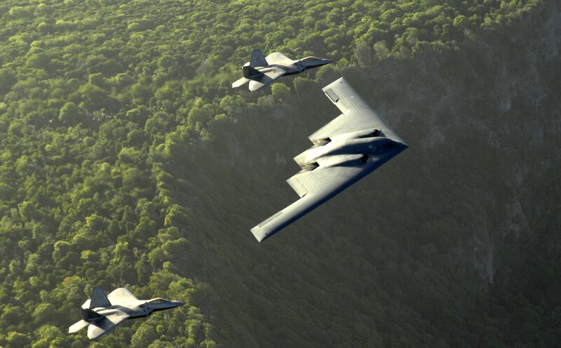 B-2 Spirit and F-22 Raptors in flight