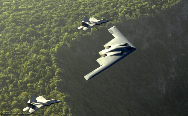 B-2 Spirit and F-22 Raptors in flight