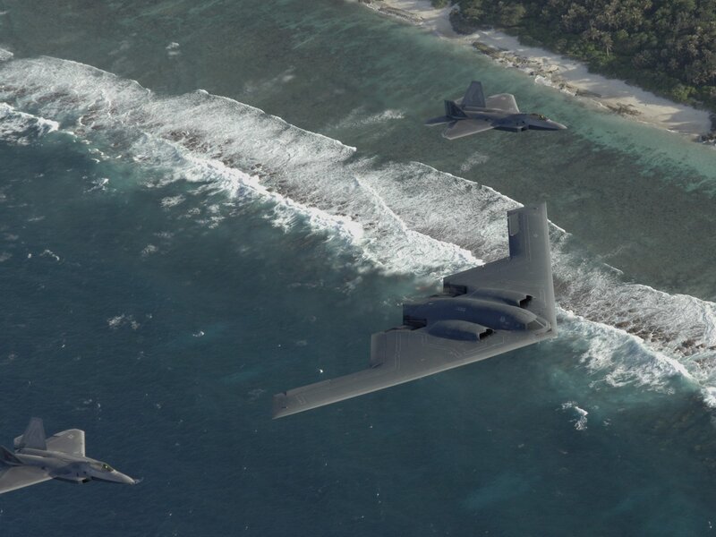 B-2 Spirit and F-22 Raptors over island
