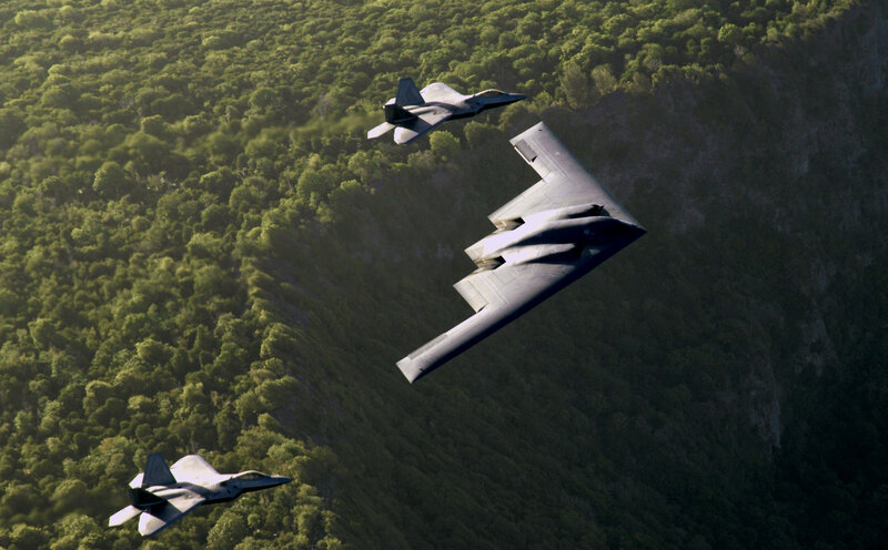 B-2 Spirit Bomber with F-22s