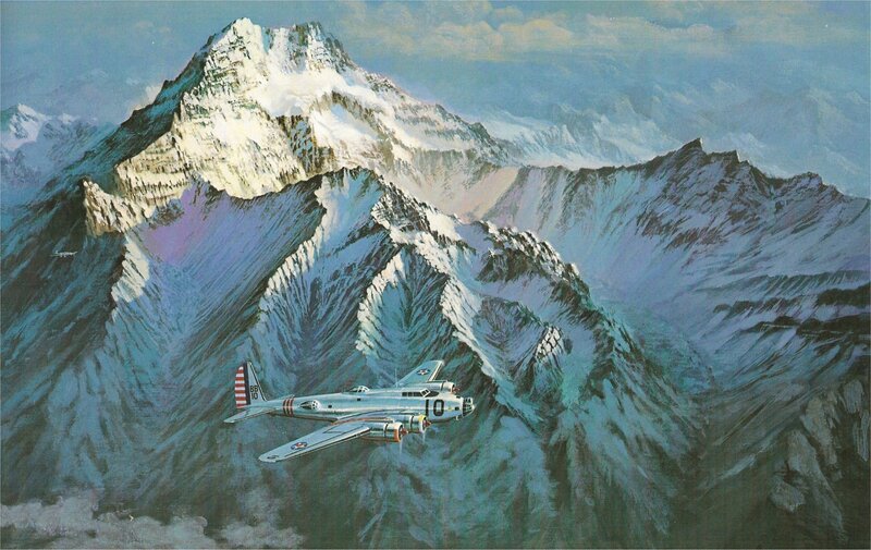 B-24 bomber over snowy mountains