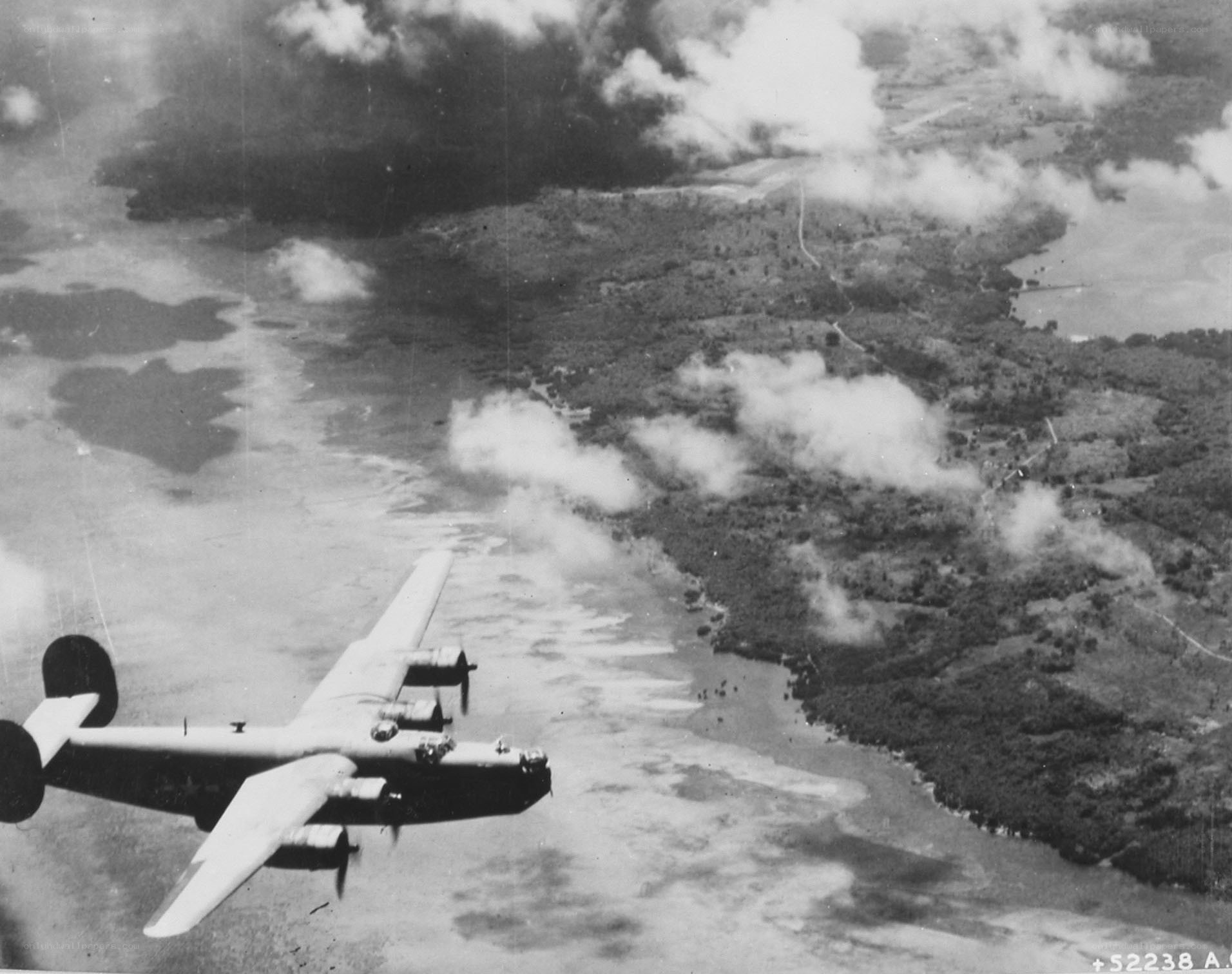 B-24 bomber over tropical island