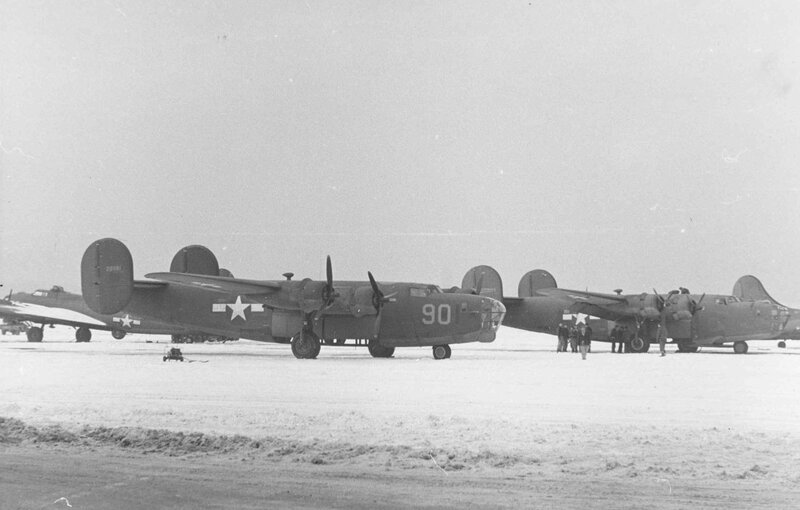 B-24 bombers on snowy airfield
