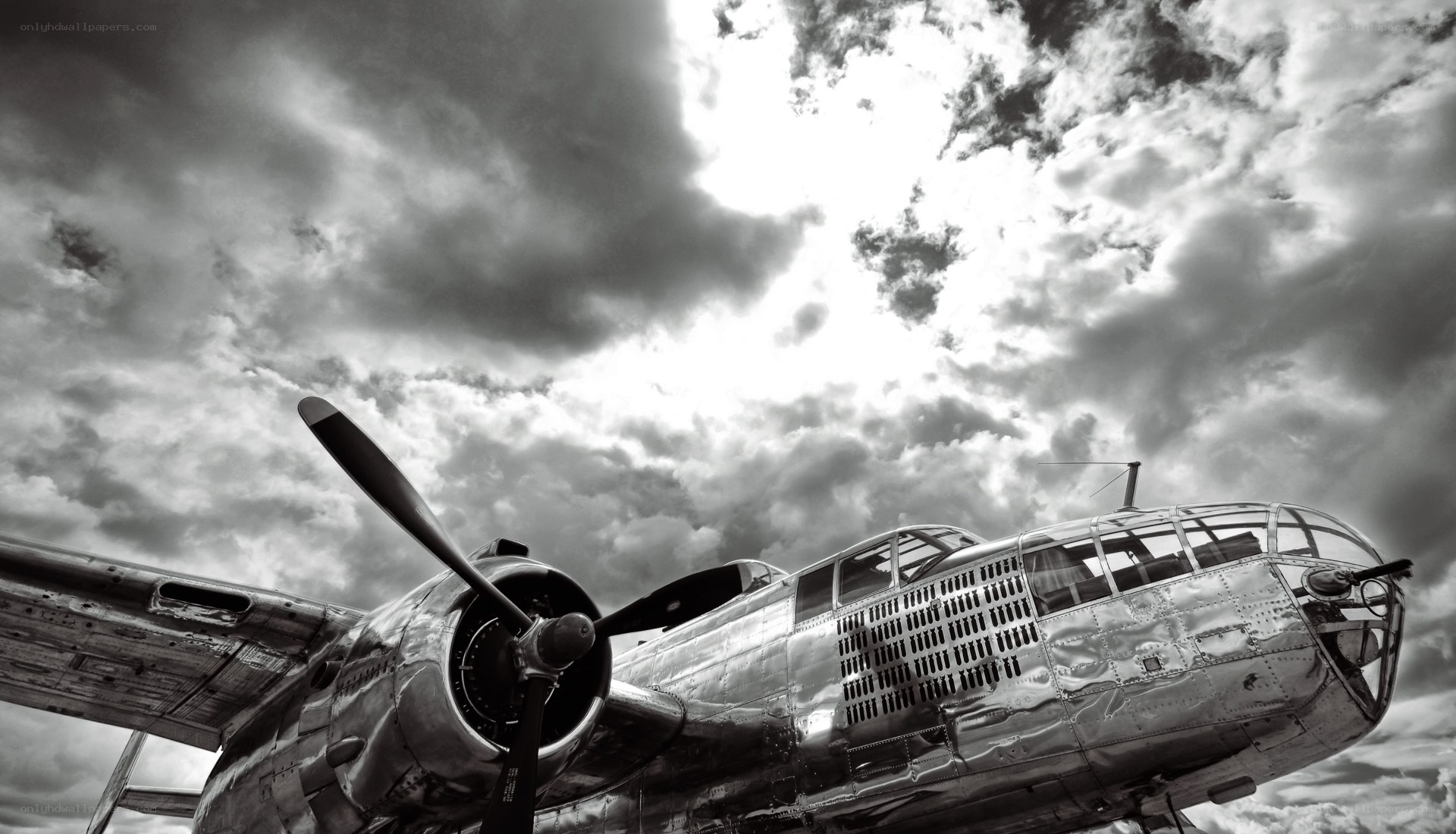 B-25 bomber under cloudy sky